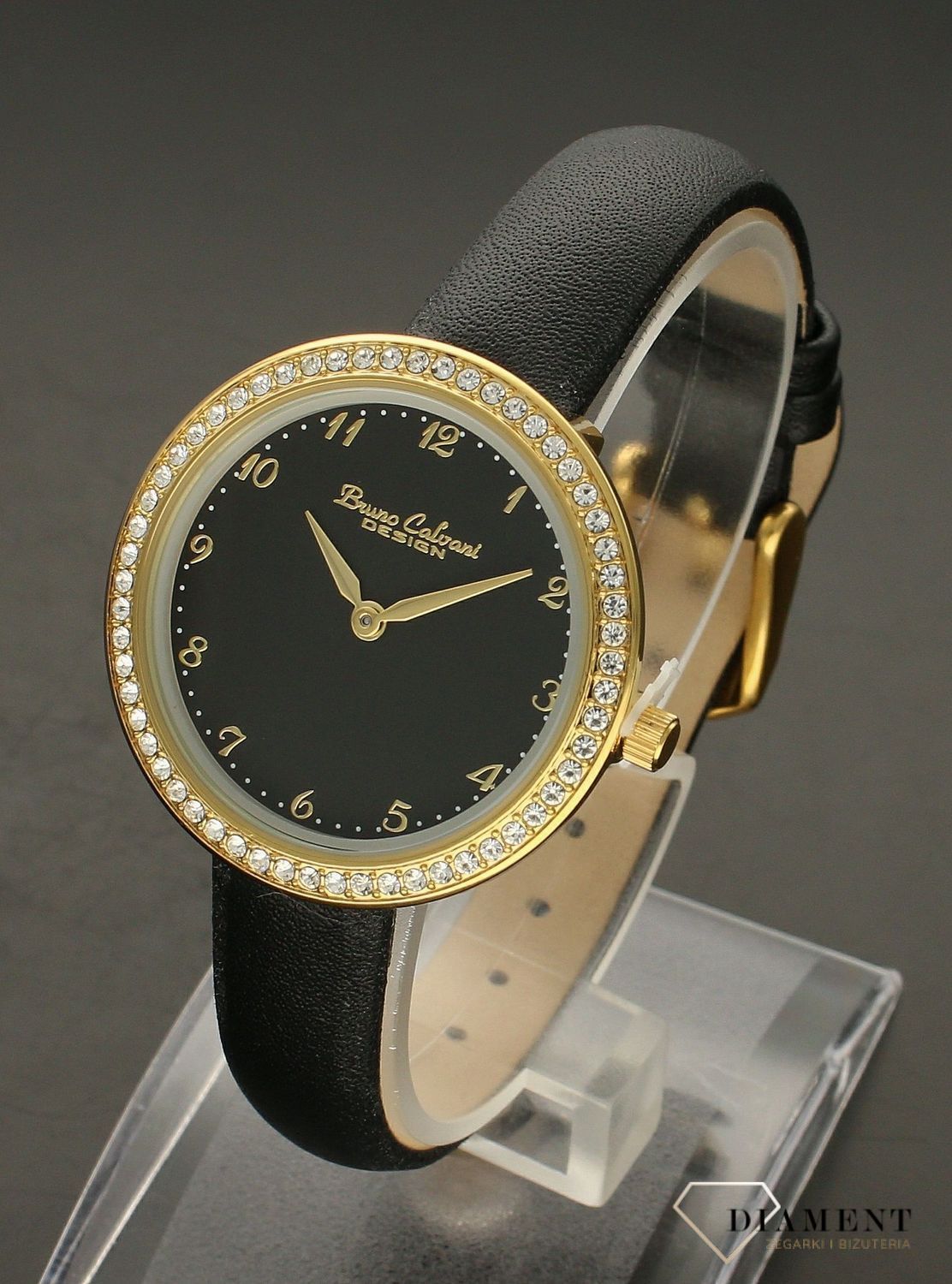 Zegarek damski na czarnym pasku Bruno Calvani BC9894 GOLD CZARNA TARCZA. Zegarek damski na czarnym pasku Bruno Calvani wyposażony jest w kwarcowy mechanizm, zasilany za pomocą baterii. Zegarek z cyrkoniami. Zegarek damski  ( (3).jpg